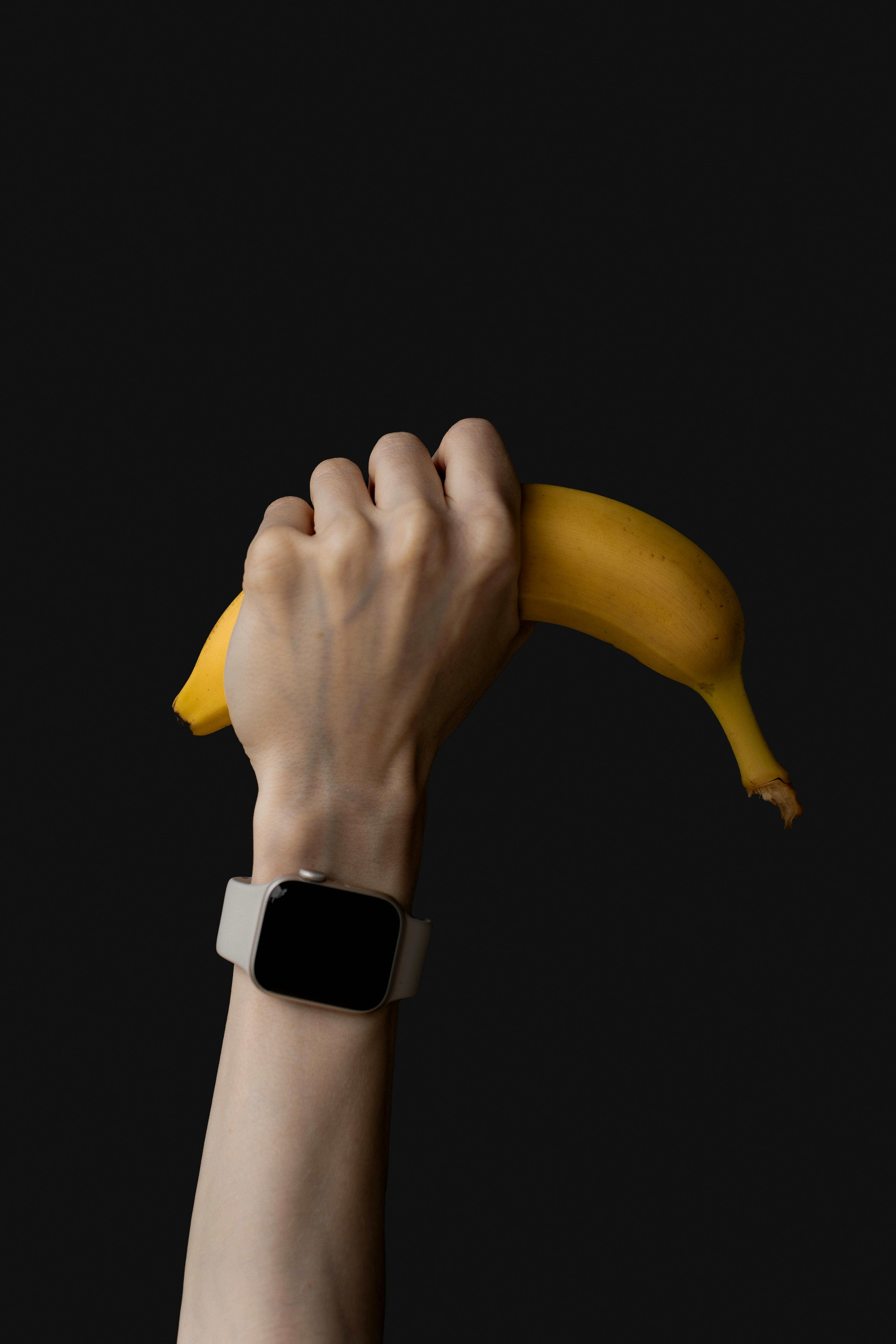 Hand Holding Banana